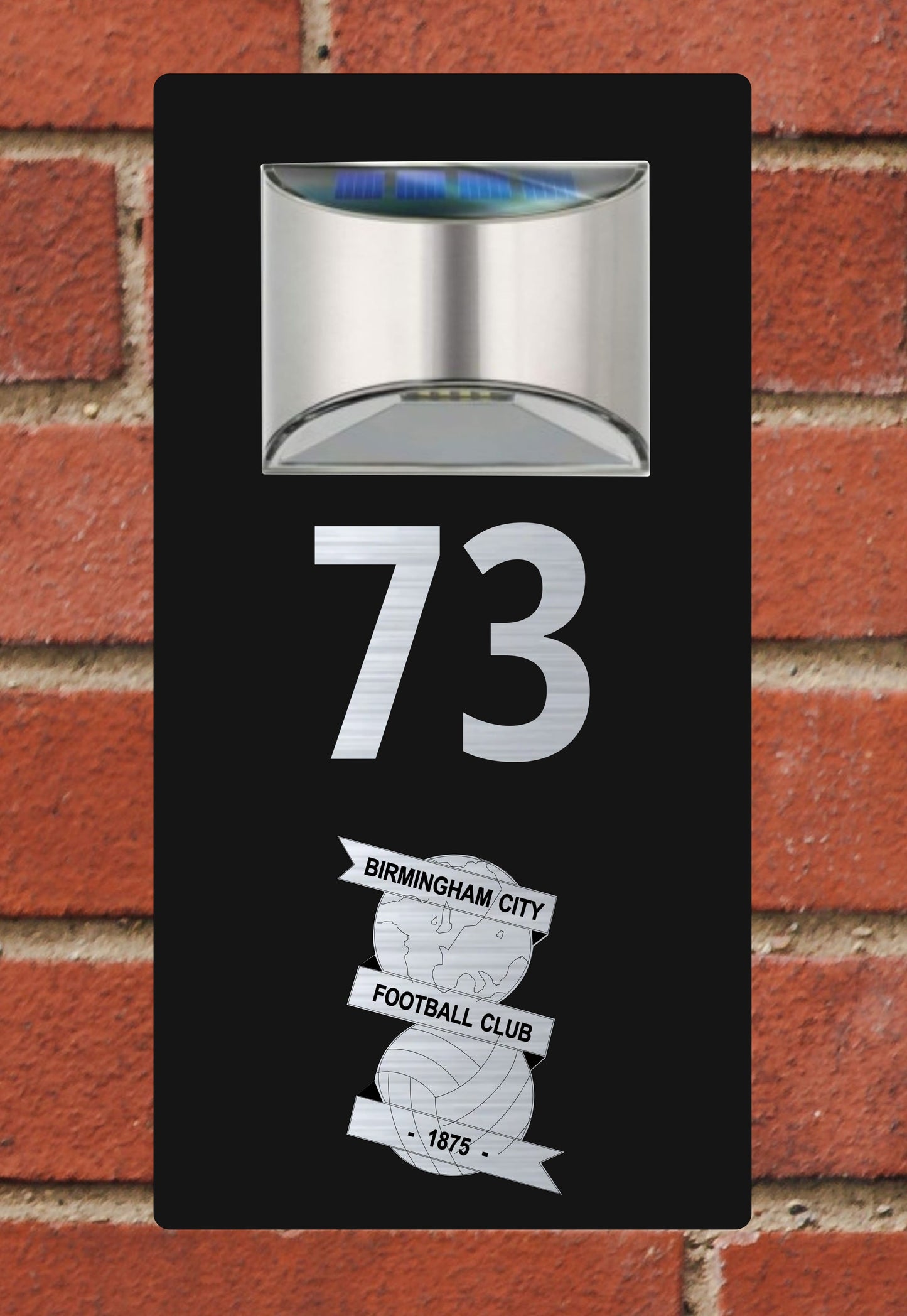 Number 73 with Birmingham City Football Club logo on a black background against a brick wall.