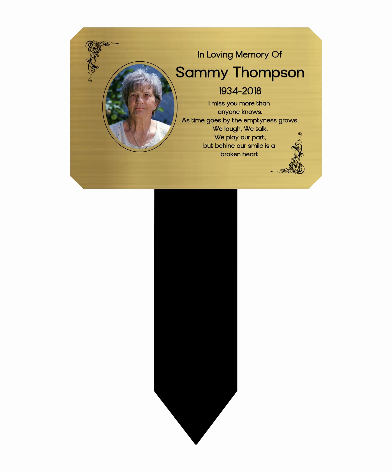 Memorial marker with gold plaque and black stake for Sammy Thompson on a white background