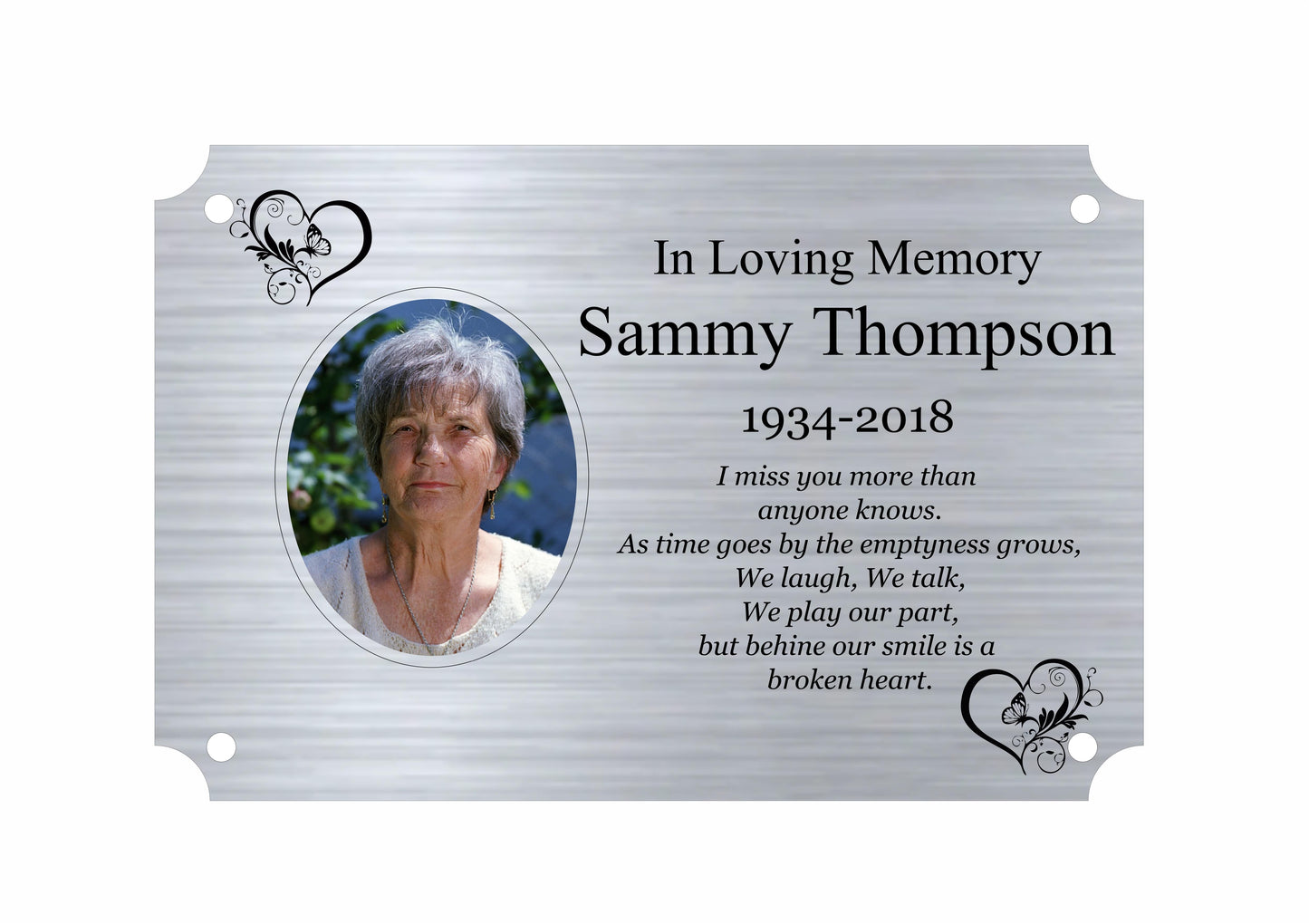 Memorial plaque with a photo of a woman and text in loving memory on a white background