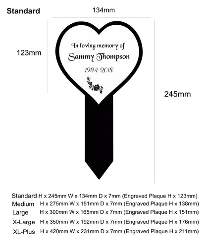 Heart-shaped memorial marker with engraved text on a white background
